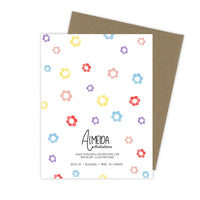 Thumbnail for Back of a greeting card with a kraft paper envelope, featuring a scattered pattern of colorful watercolor flowers and the Almeida Illustrations logo.