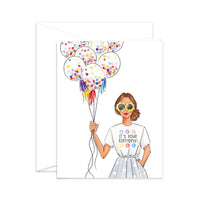 Thumbnail for Watercolor birthday card and white envelope featuring an illustration of a fashionable woman in flower-shaped sunglasses holding a bunch of confetti balloons, wearing a shirt that says 