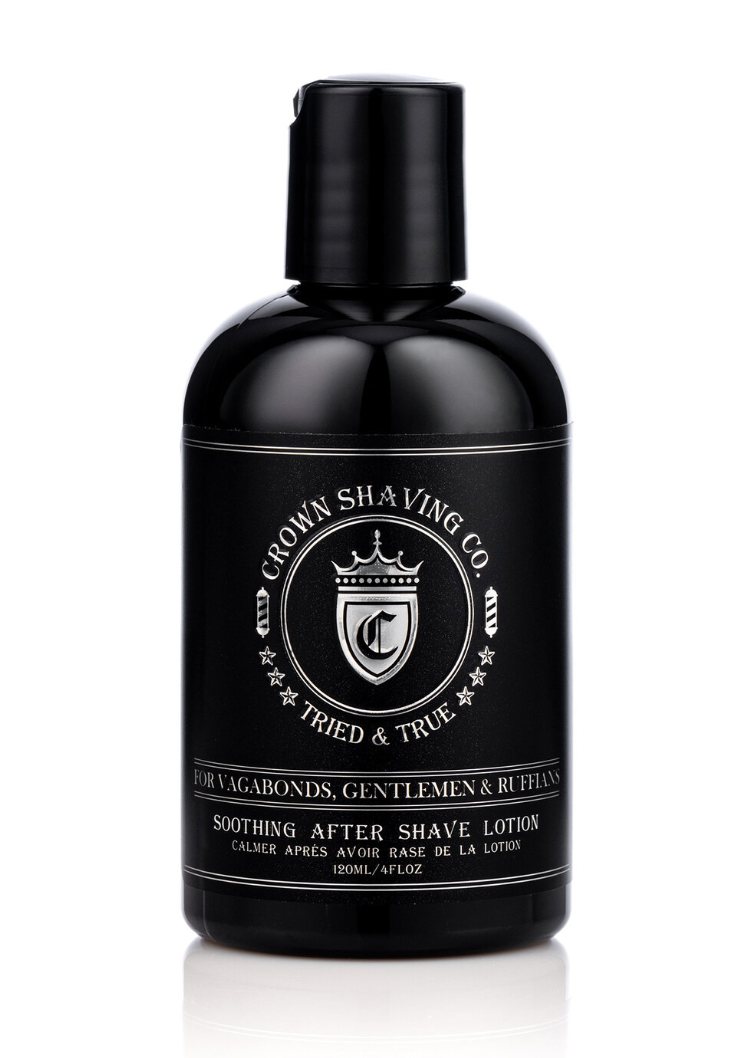 This image features a black bottle of Crown Shaving Co. Soothing After Shave Lotion on a white background. The label is clearly visible on the black bottle,  displaying the brand's logo and the product name.
