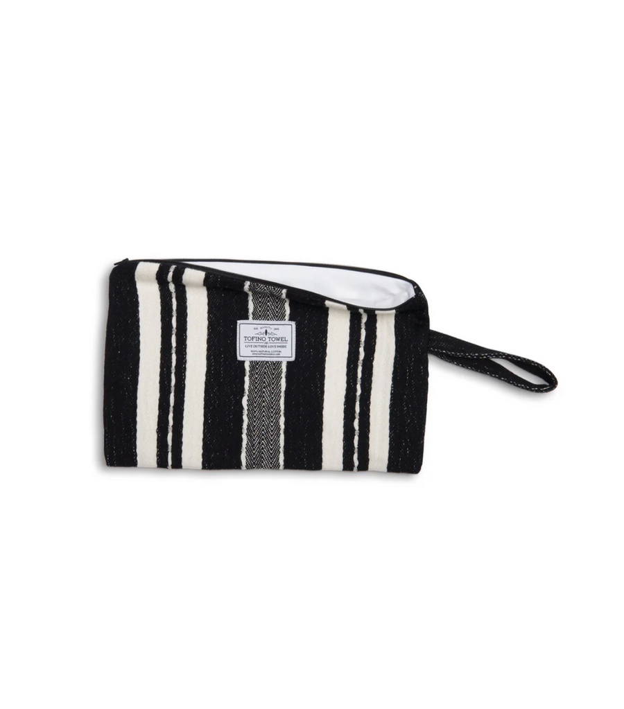 The Black/Ecru striped Mercer bag unzipped to reveal the clean, white water-resistant lining.