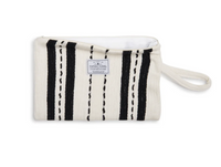 Thumbnail for A flat lay of the ecru-colored Mercer bag unzipped, showing the white water-resistant interior lining and the 