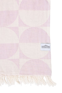 Thumbnail for A close-up of the Phase towel in Lilac, showcasing the reversible jacquard weave. The pattern features geometric half-circles in a soft lavender and cream, finished with a white 