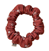 Thumbnail for Small, thin scrunchie (mini size) in a dusty rose or dark mauve ribbed fabric with a pattern of small white and dark gray flowers.