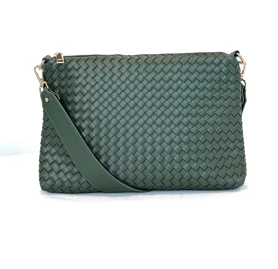 A green woven vegan leather shoulder bag on white background. 