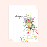 Thumbnail for Watercolor illustration of a vintage red bicycle with a basket overflowing with colorful spring flowers, featuring the handwritten text 