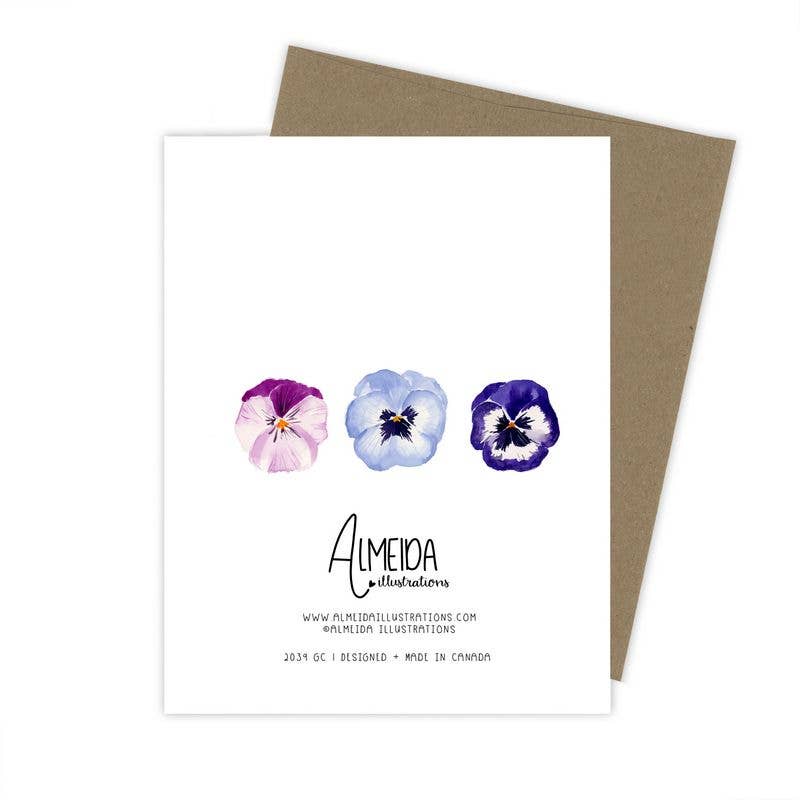 The back of a greeting card with a kraft paper envelope, featuring three watercolor pansies in shades of purple and blue above the Almeida Illustrations logo.
